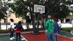 Group of friends playing basketball